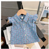 A blue floral print girls' shirt is displayed on a wooden hanger against a white background.