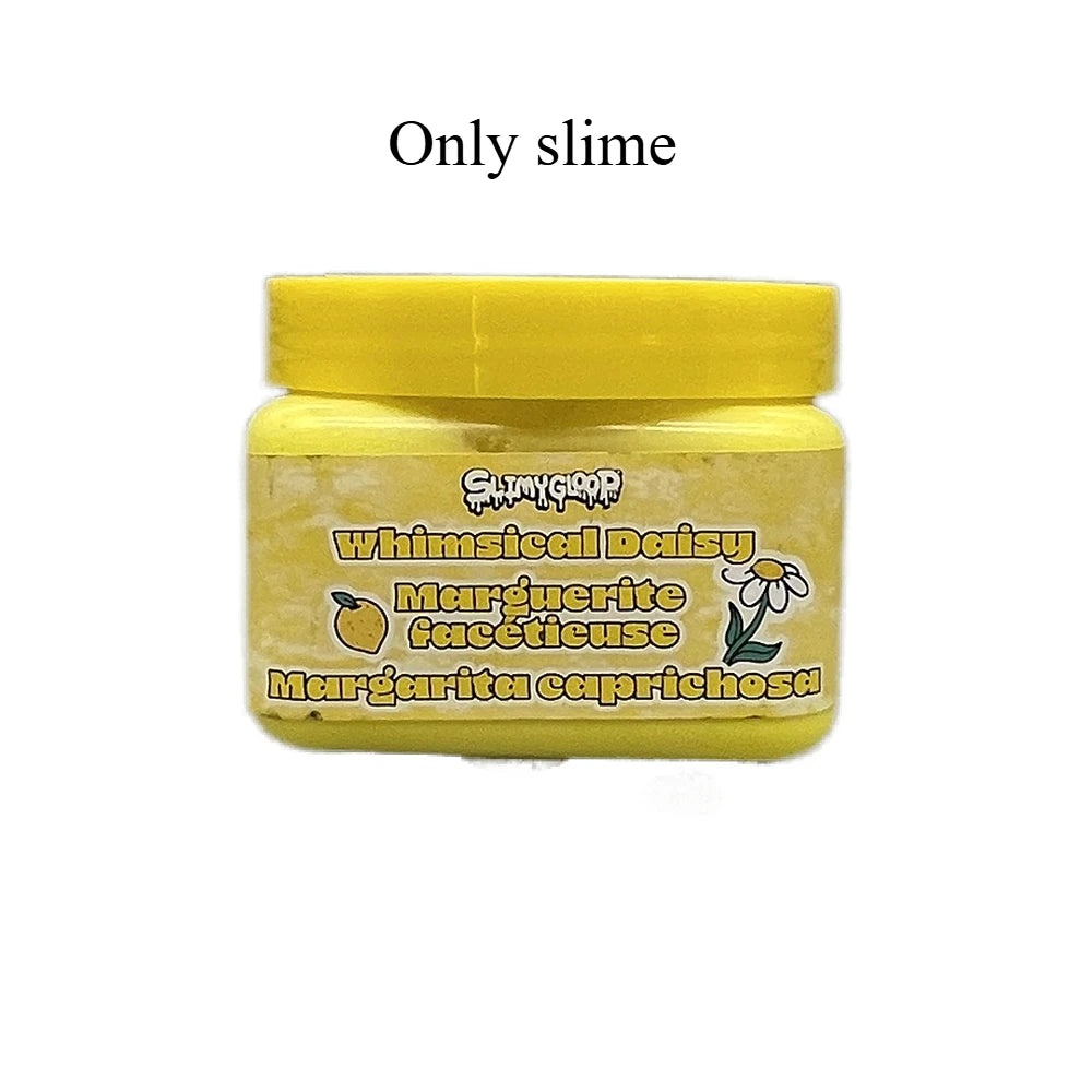 A yellow jar of slime labeled Whimsical Daisy featuring Margerite facettiseuse and Margarita capriccosa.