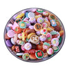 A colorful assortment of miniature dollhouse snack food items including cakes cookies and pastries