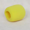 A yellow foam windscreen pop filter cover shaped like a cylinder.