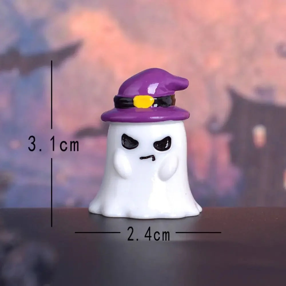 A white ghost figurine wearing a purple witch hat with a yellow accent, displayed against a blurred background.