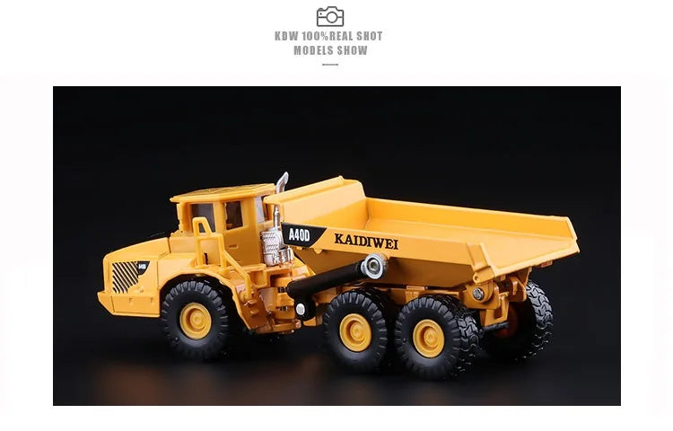 A yellow 1:87 scale diecast model of an articulated dumper truck.