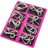 A pink plastic tray holding various silver metal wire puzzles and brain teasers.