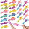 A collection of six colorful mini dinosaur finger slingshots or toys shown against a white background.