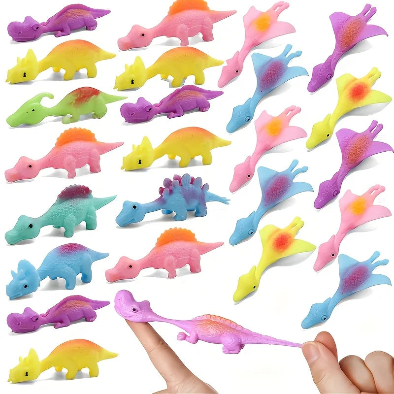 A collection of six colorful mini dinosaur finger slingshots or toys shown against a white background.