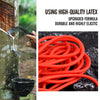 A coil of bright orange latex rubber used for a slingshot or elastic band.