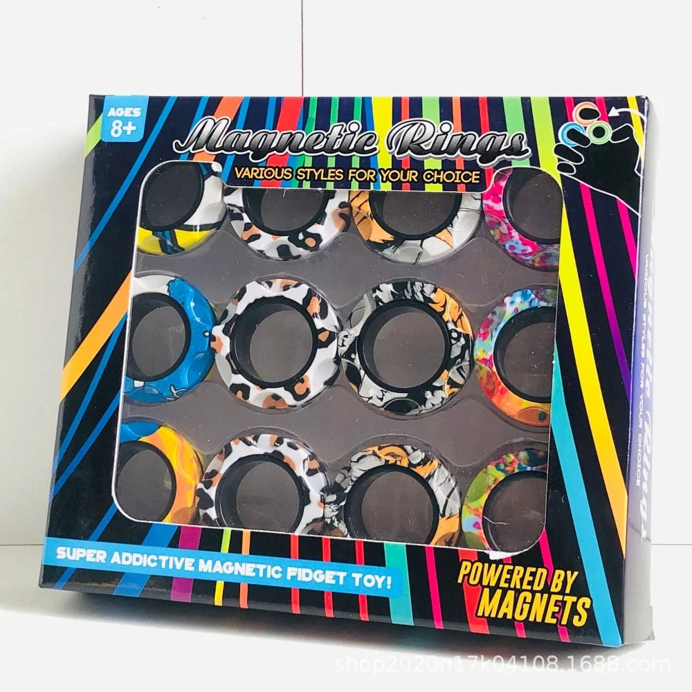 A box of magnetic rings for fidget toys featuring various styles and colors.