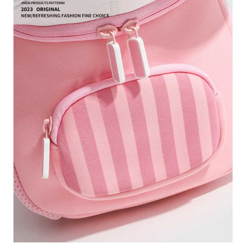 Pink mini backpack with a striped pocket and white zipper pulls