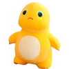 A yellow, smiling dinosaur plush toy with large green eyes and a light beige belly.