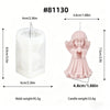 A pink silicone mold shaped like a praying angel for making candles and resin.
