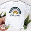 White t-shirt featuring a rainbow graphic and the text Kids Name on the chest