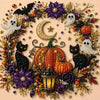 A circular arrangement of Halloween-themed decorations including black cats, white ghosts, and orange pumpkins made with pear