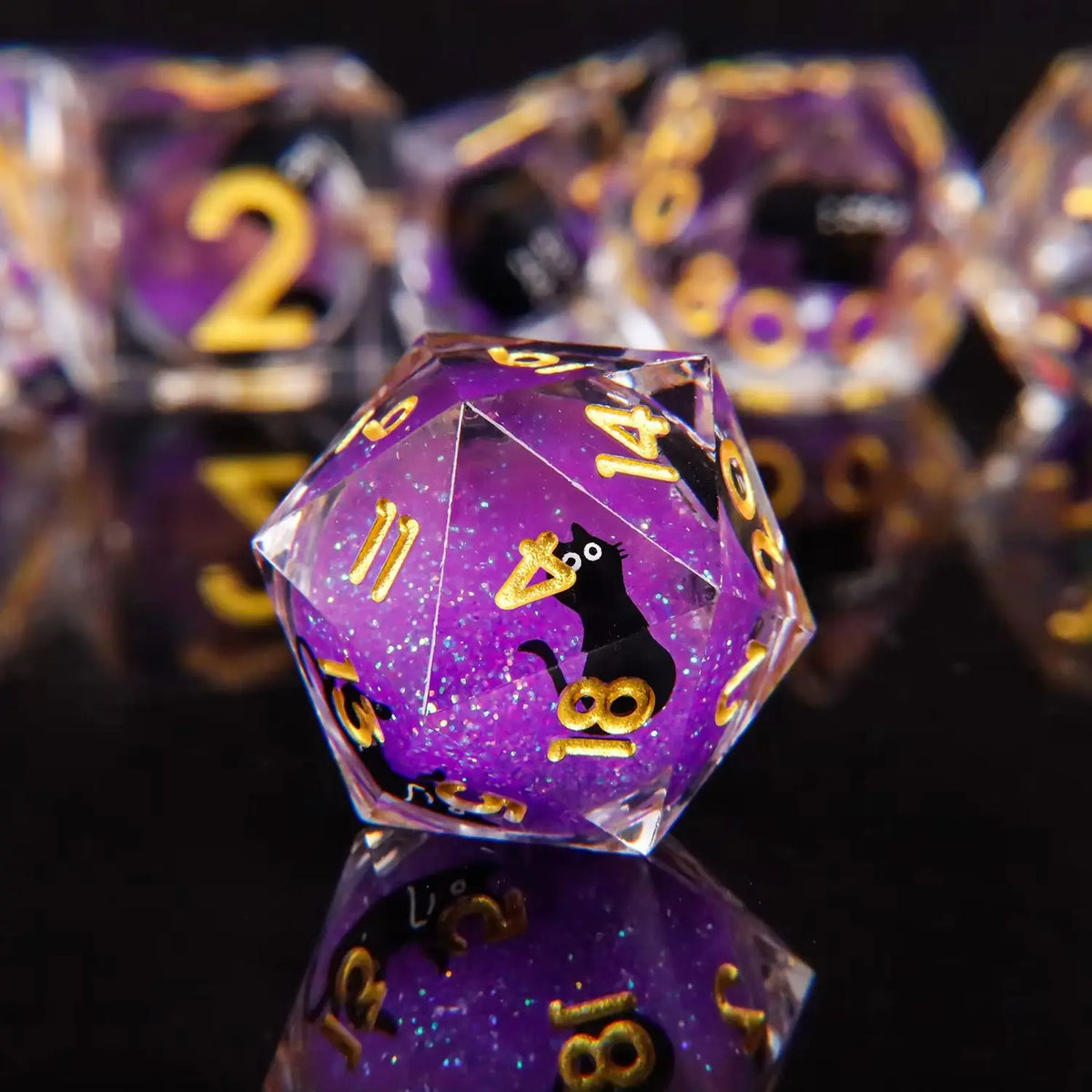 A close-up of a purple liquid core dice set featuring numbered dice with a black cat design.