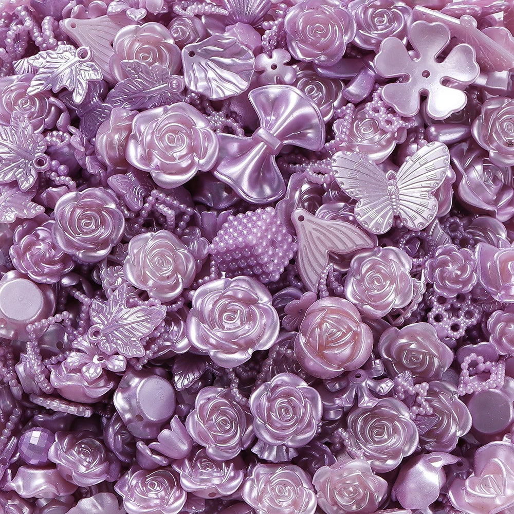 A close-up of iridescent purple and pink butterfly shell acrylic beads for DIY jewelry making