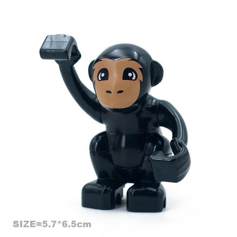 A black building block figure of a lion with an raised paw.