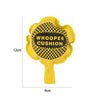 Yellow whoopee cushion with a black and yellow checkered pattern and the text WHOOPEE CUSHION