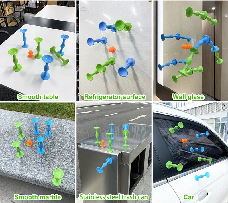 A set of silicone suction cup darts in various colors and shapes shown on a smooth table, marble, refrigerator surface, and i
