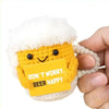 Handmade crochet beer mug buddy with a yellow card featuring the text Don't worry beer happy