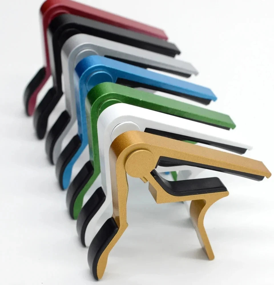 A set of aluminum alloy quick-change guitar caps in various colors arranged diagonally.