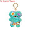 Tie-dyed color random plush monster keychain with purple and blue fur and a bright orange belly