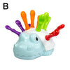 A plastic toy shaped like a hedgehog with colorful, oversized protrusions for fine motor skill practice.