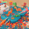 A colorful dinosaur drill and screw building toy set with an electric drill is shown with various plastic pieces.