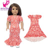 A doll wearing a red floral dress outfit set with a matching blouse, skirt, and tights.