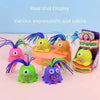 A collection of colorful, expressive monster stress relief toys with various expressions and colors displayed on a light back