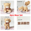 A set of four adorable bear figures including seated and standing bears with bowties for birthday or baby shower decorations