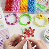 A hand is stringing a red bead onto a white string for a DIY bracelet making kit.