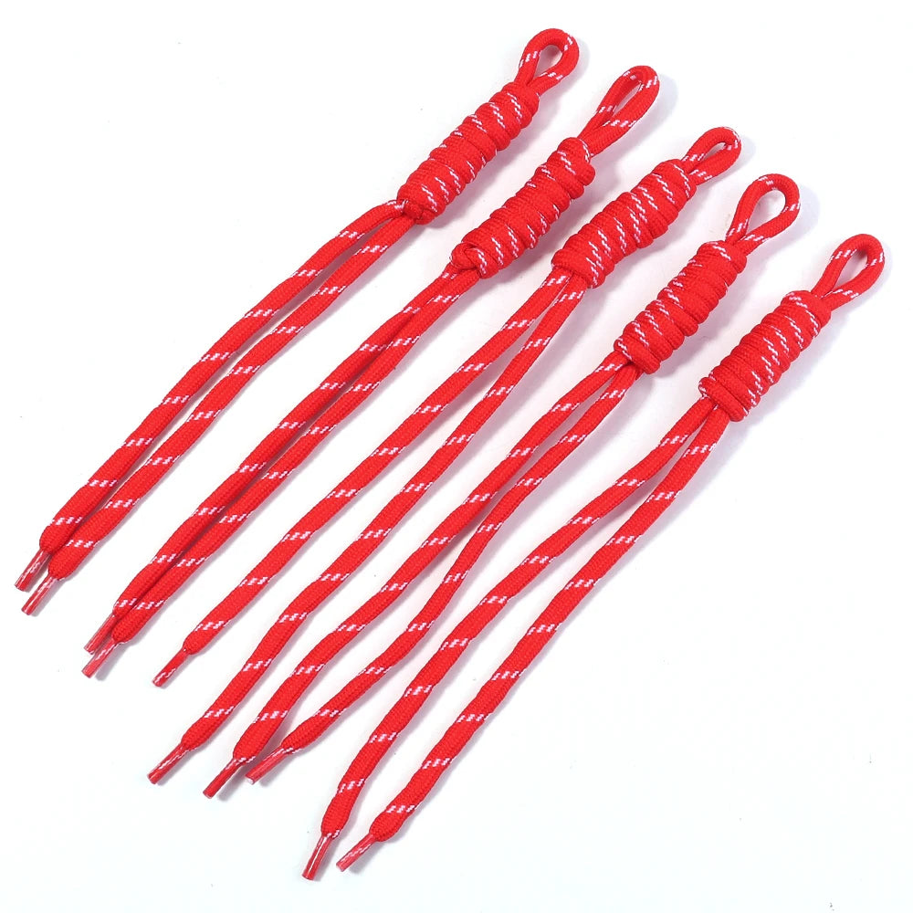 Red braided lanyard keychains arranged diagonally on a white background