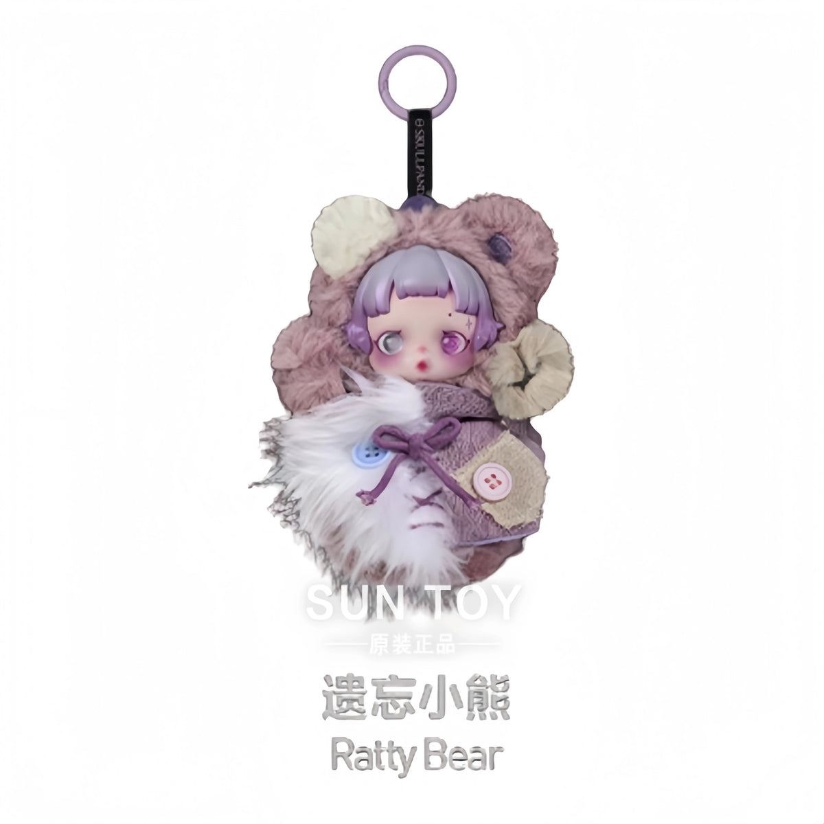 A Raty Bear collectible figure with pink hair and fluffy brown fur, packaged in a mystery box.