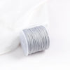 A roll of gray 0.8mm cotton nylon macrame cord for jewelry making and crafts.