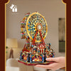 A detailed wooden model kit of a Ferris wheel music box dollhouse featuring colorful structures and miniature figures.