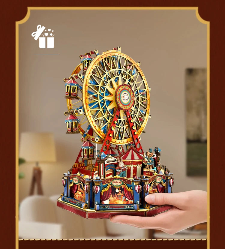 A detailed wooden model kit of a Ferris wheel music box dollhouse featuring colorful structures and miniature figures.
