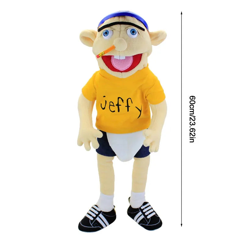 A yellow Jeffy hand puppet plush toy with blue hair and a red tongue, standing upright.