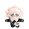 A pink plush pendant doll featuring a stylized face with pink hair and black clothing.