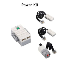 A power kit for a STEM programming building blocks set, showing various electronic components and connectors.