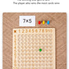 A wooden multiplication board game showing the equation 7x5 and a numbered grid for solving problems.