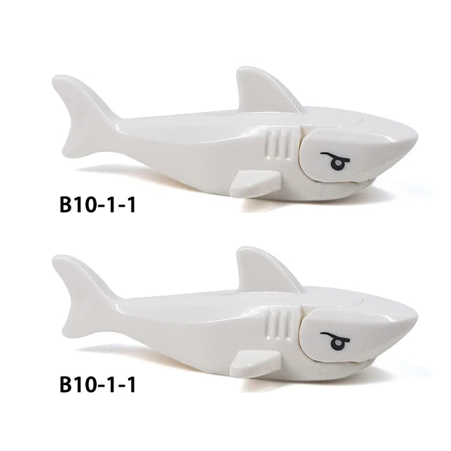 White plastic shark building block with a stylized face and fins.