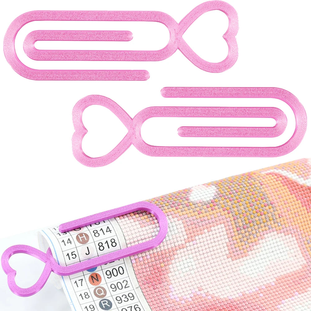 A set of two pink heart pattern diamond painting canvas clips with numbered labels