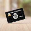 A black card with gold accents and the text Mexican Express is shown on a wooden surface.