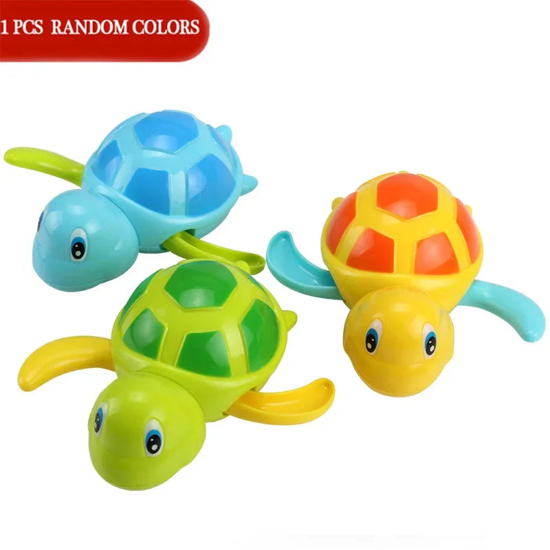 A set of three colorful wind-up swimming turtle bath toys in blue, orange, and green.