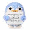 Handmade crochet blue penguin doll with a white card that reads I may be a tiny penguin but I believe in you go do your thing