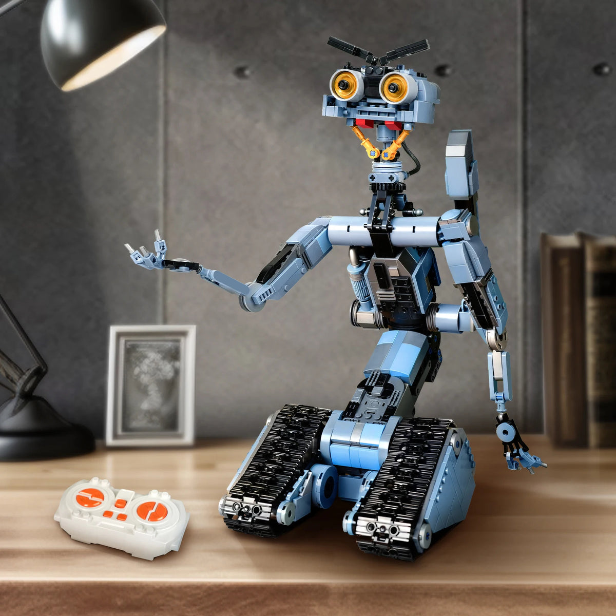 A blue and black motorized military mech robot building block set standing on a wooden surface.