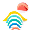 A set of colorful wooden rainbow blocks arranged in a fan shape.