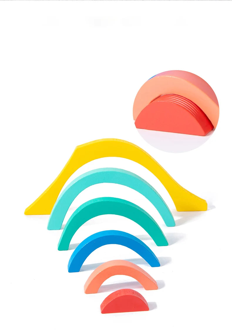 A set of colorful wooden rainbow blocks arranged in a fan shape.