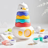 A stack of colorful, egg-shaped Montessori matching toys for toddlers, featuring yellow, blue, and orange colors.
