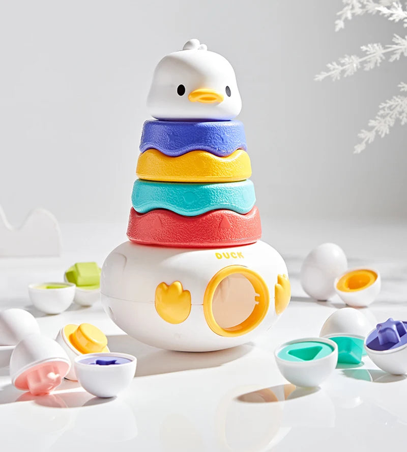A stack of colorful, egg-shaped Montessori matching toys for toddlers, featuring yellow, blue, and orange colors.