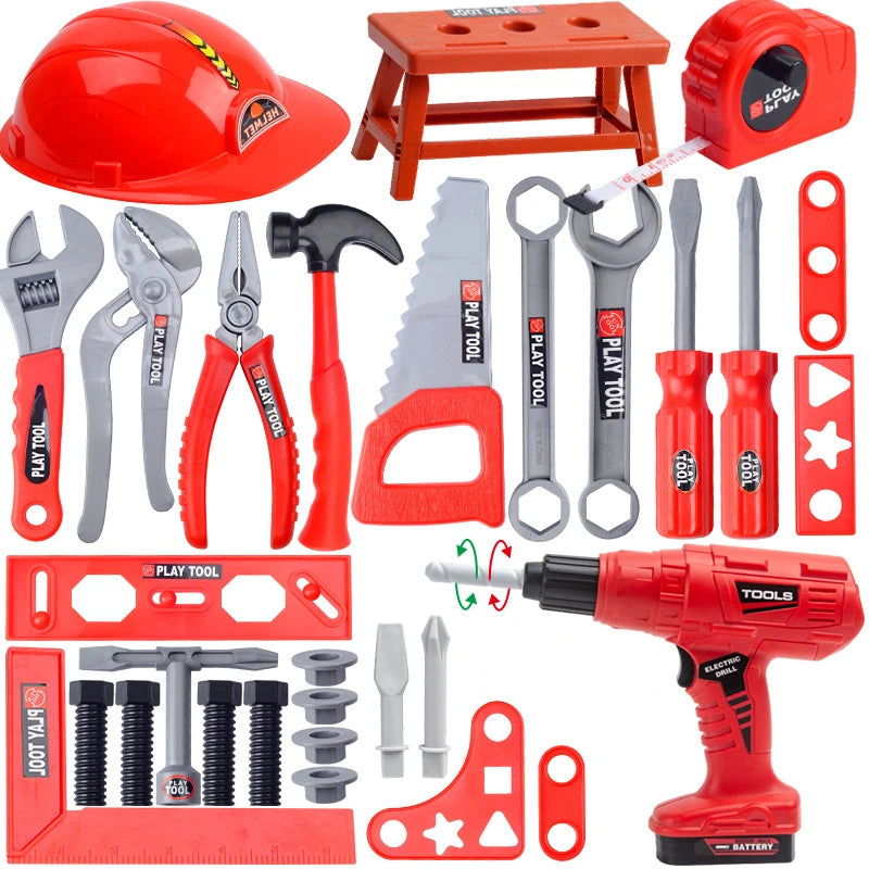 A red kids tool set featuring a battery-powered toy drill, various hand tools like pliers and hammers, and a wooden box.